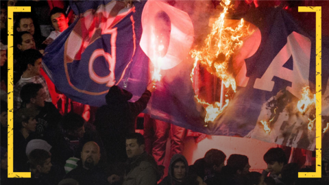 Hajduk Split fans set fire to a Dinamo Zagreb flag