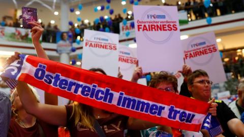 Supporters wait for Head of Austrian far-right Freedom Party (FPO) Heinz-Christian Strache during an election campaign rally in Vienna, Austria, September 1, 2017