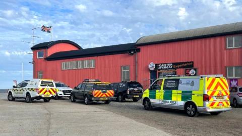 Emergency service vehicles on Norfolk coast