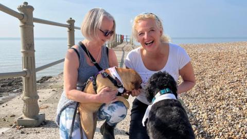 Chris Penhale with dog Peggy (left) and Anne Pottle with dog Benson (right)