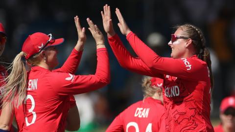 England's Sarah Glenn (L) and Sophie Ecclestone (R) celebrate a wicket