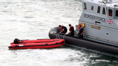 Small boat being towed into Dover