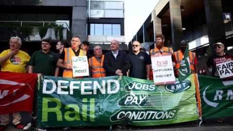Mick Lynch, General Secretary of the RMT union on a picket line in London recently