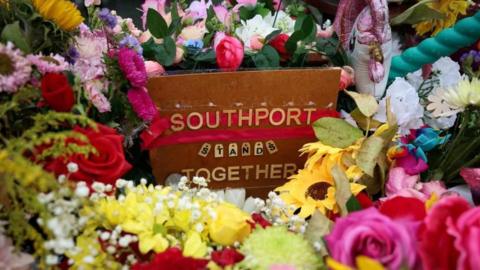 Flowers gathered in tribute following the Southport attack in September 2024