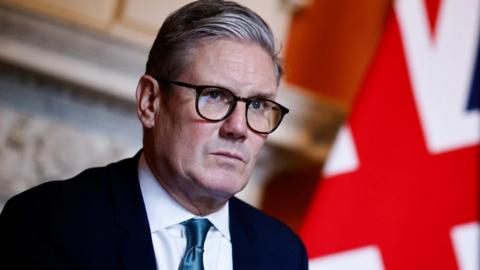 Prime Minister Sir Keir Starmer with a union flag in the background