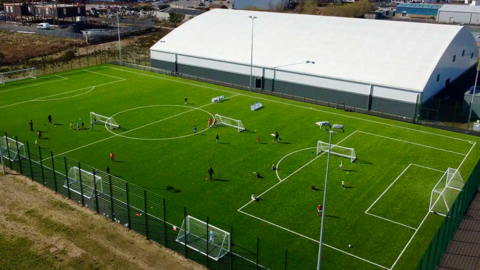 An aerial view of an artificial football pitch  
