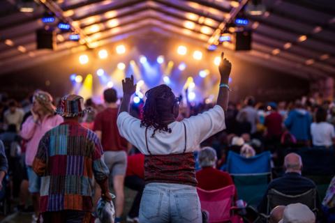 Crowds dancing at Cambridge Folk Festival 2023