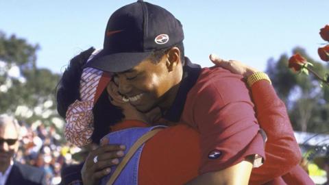 Tiger Woods hugs his mother Kultida after winning the Buick Invitational tournament in 1999