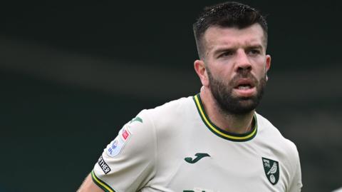 Grant Hanley in action for Norwich