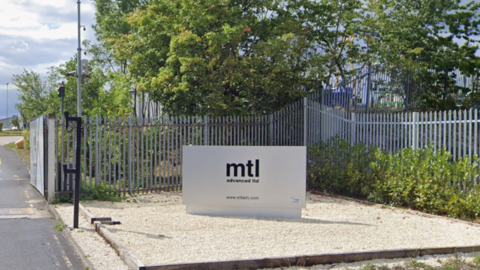 An entrance sign to MTL Advanced Ltd. The sign is silver with MTL Advanced Ltd written in bold black text.