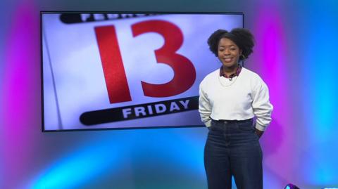 Emma-Louise in the studio with "Friday 13" in the screen