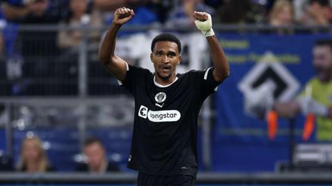 Andreas Hountondji of St Pauli celebrates scoring his team's second goal during the Bundesliga match between Hamburger SV and FC St. Pauli 