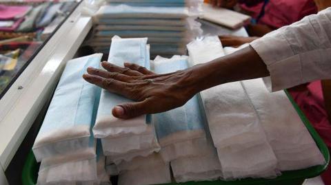 Employees of Myna Mahila Foundation prepare sanitary pads at their office in Mumbai on April 10, 2018. 