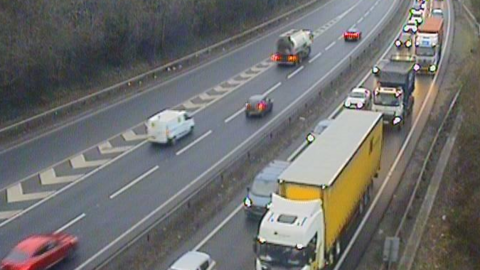 Traffic pictured on the A14 close to Ipswich. Queues of vehicles can be seen on the carriageway closest to the camera. Traffic on the opposite side can be seen moving well.