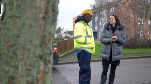 Yaw Botwe and Khialah Wison standing talking on a street in Stockton