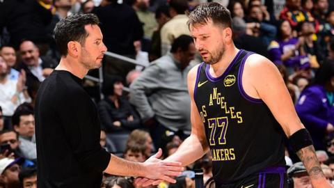 Luka Doncic of the Los Angeles Lakers shakes hands with head coach JJ Redick during a game against the Atlanta Hawks in January 2026