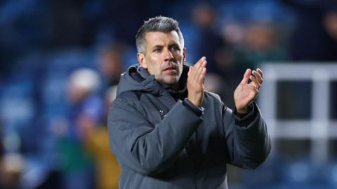 Paolo Pezzolano clapping to fans