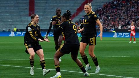 Malard celebrates with Manchester Utd team mates