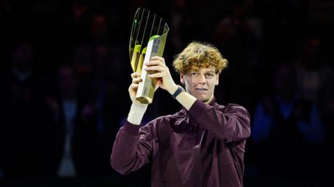 Jannik Sinner of Italy poses with his Vienna Open trophy