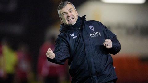 Lincoln boss Michael Skubala punches the air in celebration