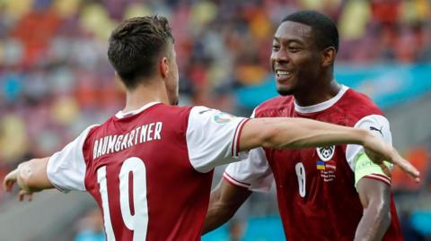 Christoph Baumgartner celebrates with Austria team-mate David Alaba