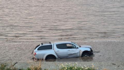 Image of a car driven into water