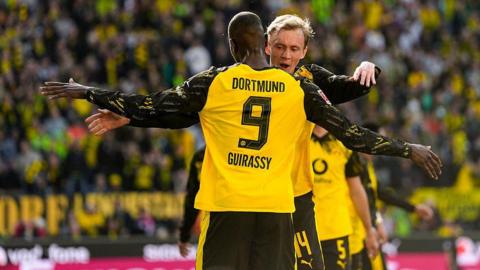 Borussia Dortmund celebrate their second goal against Freiburg.