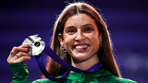 Kate O'Connor holds her silver medal