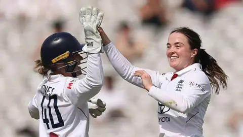 England's Mady Villiers celebrates a wicket