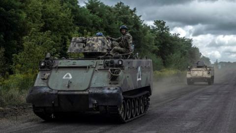 Ukrainian servicemen operate a tank in the Sumy region