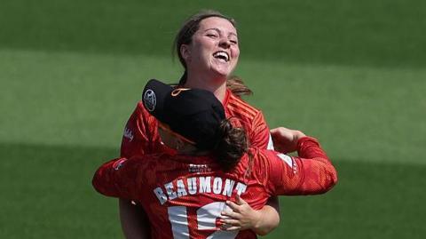 Grace Ballinger celebrates the first wicket
