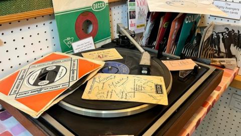 A vinyl covered in music records
