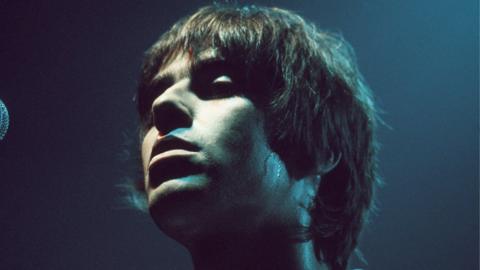 Liam Gallagher onstage in Cambridge in December 1994 during Oasis's Definitely Maybe Tour.