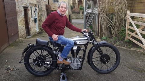 Bill Southcombe sitting on his vintage Norton CSI motorbike