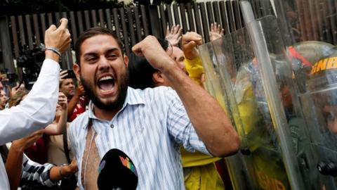 Juan Requesens clashes with Venezuela's National Guard during a protest outside the Supreme Court of Justice (TSJ) in Caracas, Venezuela March 30, 2017