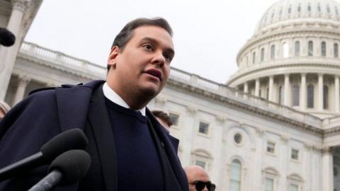 Rep. George Santos (R-NY) is surrounded by journalists as he leaves the U.S. Capitol after his fellow members of Congress voted to expel him from the House of Representatives on December 01, 2023 in Washington, DC.