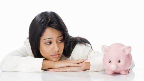 Woman with piggy bank