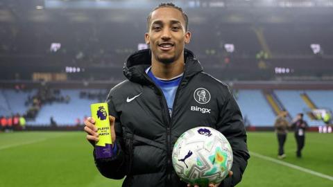 Joao Pedro with the Player of the Match award and match ball