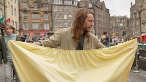 Dan Boerman folds a sheet in Edinburgh
