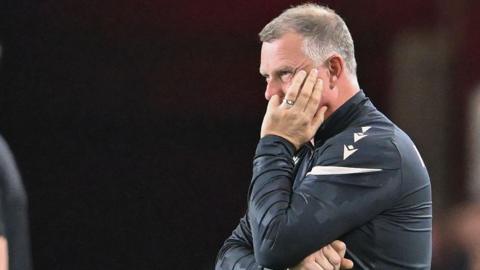 Mark Robins looks frustrated