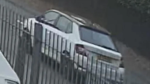 CCTV image of white Skoda driving along the line