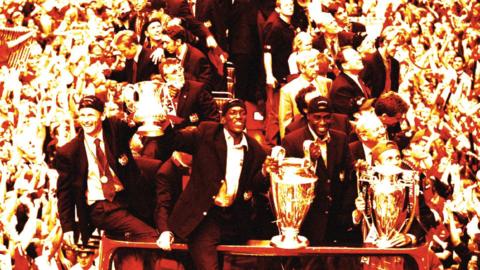 Manchester United celebrate the Treble in 1999.