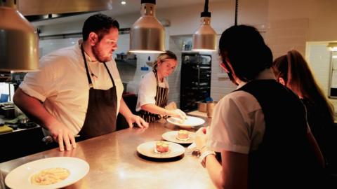 Staff working in the kitchen at The Grove, Narberth