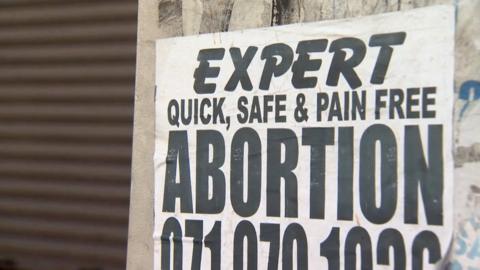 A sign for a backstreet abortionist in Kenya