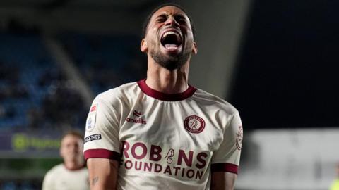 Bristol City defender Zak Vyner shouts in celebration after opening the scoring at Millwall