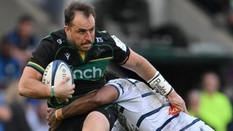 Burger Odendaal is tackled during Northampton's game against Castres