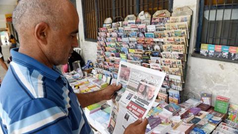 A Moroccan reads an issue of Al Ahdath Al Maghribia in Rabat