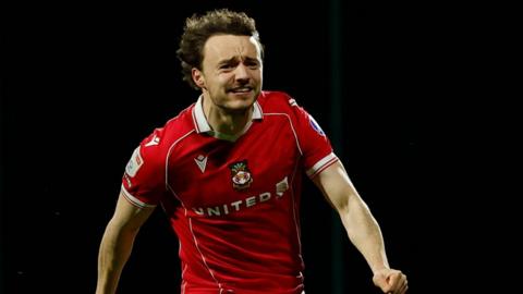 Wrexham's Ollie Rathbone celebrates