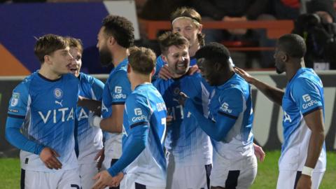 Stockport celebrate Oliver Norwood's goal