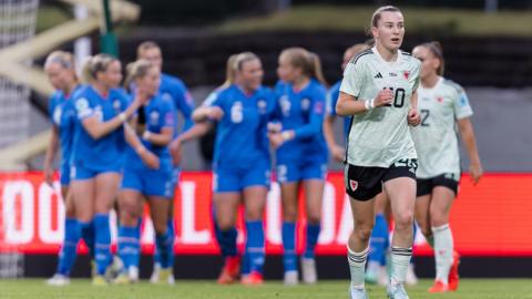 Carrie Jones runs back to half way line after Iceland's opening goal